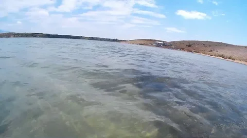 Dive with action cam near sandy beach in northern Croatia Stock Footage 92933820