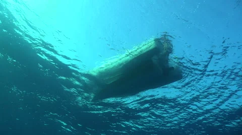 Dive boat floating at sunlight - view from underwater Stock Footage 58404289