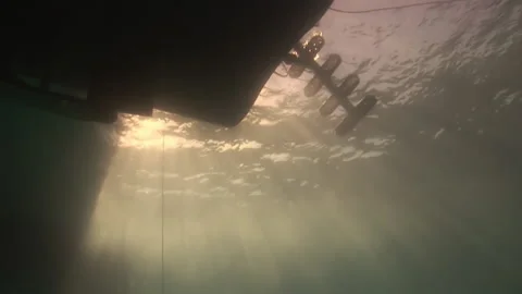 Dive deck basking in sun, overlooking crystal-clear waters underwater view. Stock Footage 235603222