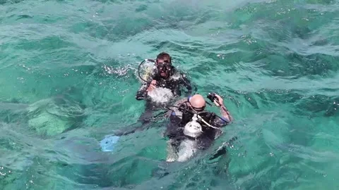 The dive with an instructor in the waters of the Red Sea Stockbeeldmateriaal 159438976
