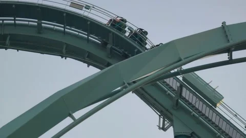 Dive Roller Coaster in Theme Park Stock Footage 223603387
