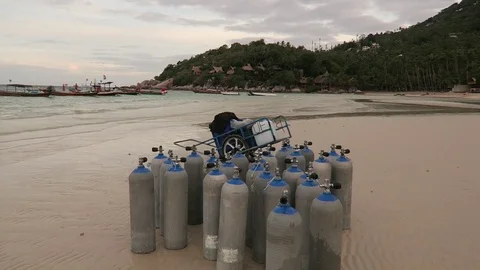 Dive tanks on beach Stock Footage 80853039