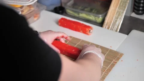 Dive into world of sushi creation as master of. Japanese cuisine skillfully Stock Footage 268741401