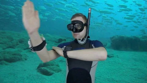 Divemaster shows direction on the compas- greenscreen footage Stock Footage 123951543