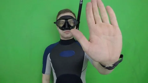 Divemaster shows signal – STOP Stock Footage 124320858