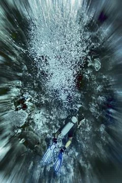 Diver with air bubbles, zoom effect, example image for emergency situation Stock Photos