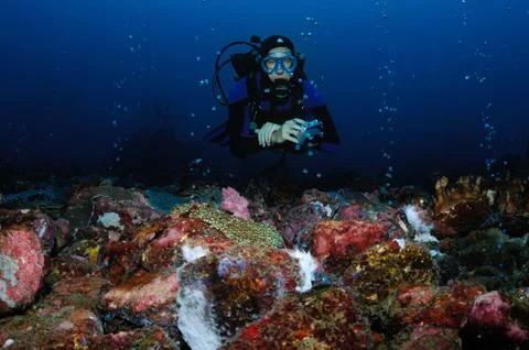 Diver and volcanic activity Stock Photos