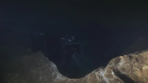 Diver From Behind Swims On The Rocky Bottom Of The Cave,Risorgenza Amaseno,Italy Stock Footage 224875833