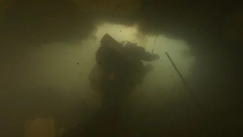 Diver from below in backlight rises towards the exit,Risorgenza Amaseno,Italy Stock Footage 109229286