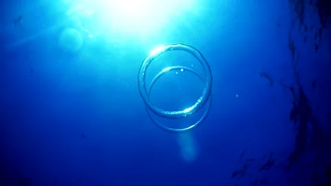 Diver Blow Bubble Rings while Freediving Cape Palos Cartagena Murcia Spain Stock Footage 130907909