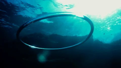 Diver Blow Bubble Rings while Freediving Cape Palos Cartagena Murcia Spain Video stock 130909654