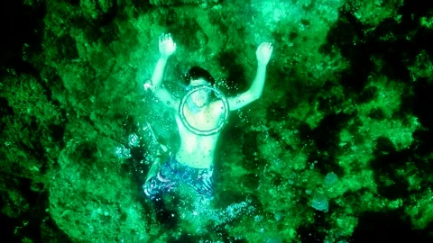 Diver Blow Bubble Rings while freediving in Spain Stock Footage 130912047