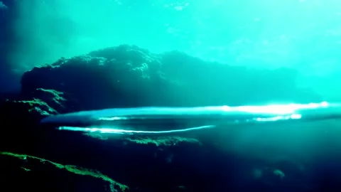 Diver Blow Bubble Rings while freediving in Spain Stock Footage 130912052