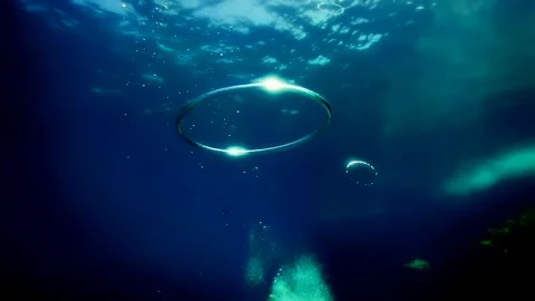 Diver Blow Bubble Rings while freediving in Spain Stock Footage 130912071