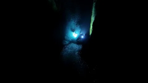 Diver with camera and lights in the cenote , Cuba Stock Footage 77440039