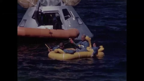 Diver checking interior of Apollo 8 back-up crew command module  Video stock 271517793