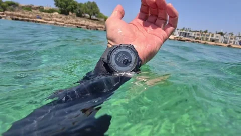 Diver Checking Wrist Compass And Dive Computer In Clear Water, Handheld Shot Stock Footage 341297964