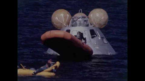 Diver closing door of Apollo 8 back-up crew command module water egress training Stockbeeldmateriaal 271517644