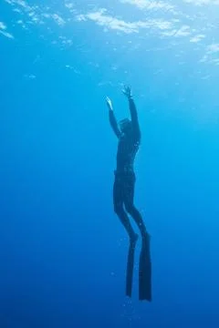 Diver in the deep water Stock Photos