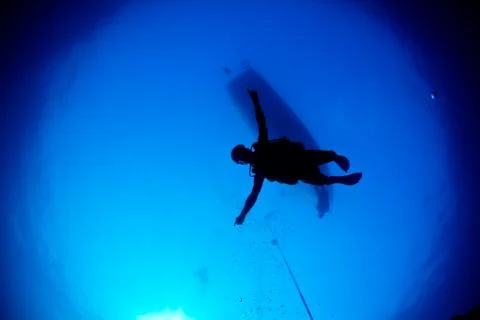 Diver descending Stock Photos