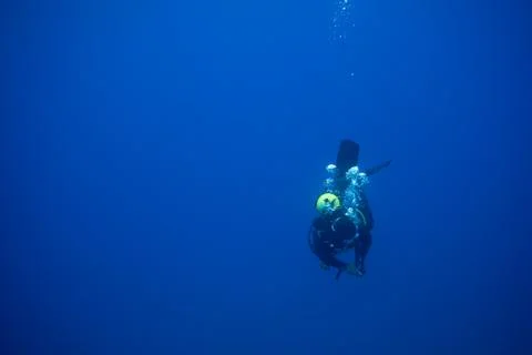 Diver diving into the blue Stock Photos