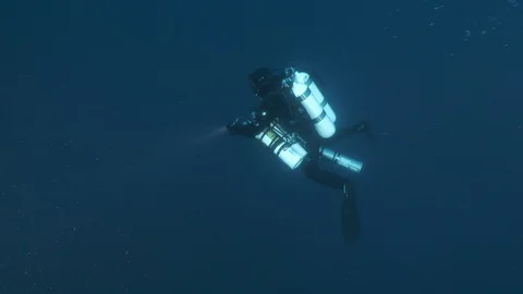 DIver diving with torch and makes bubbles, Giannutri, Mediterranean sea, Italy Stock Footage 108065136