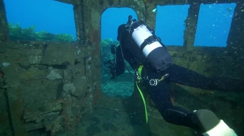 Diver exits wreck Video stock 58381430