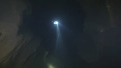 Diver explores the cracks in the rocks in the cave, Amaseno,Italy Stock Footage 224465262