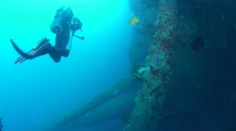 Diver exploring the side of the USS Coolidge Stock Footage 40731714
