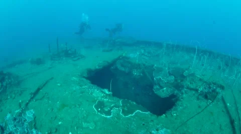 Diver exploring the side of the USS Coolidge Stock Footage 40731728