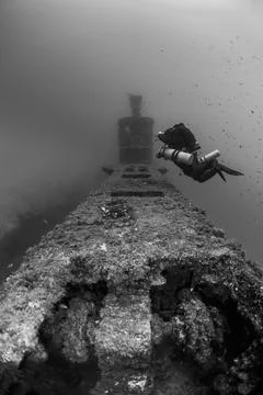 Diver exploring submarine wreck in Malta waters Stock Photos