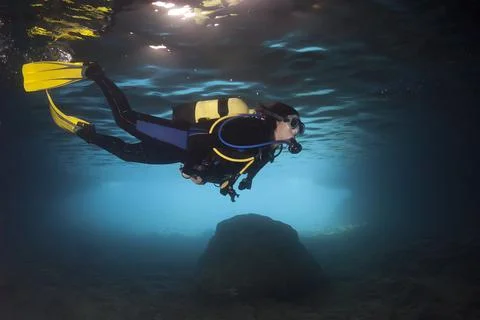 Diver exploring an underwater cavern in the Mediterranean 스톡 사진