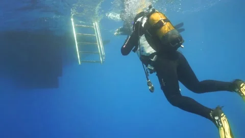Diver Floating on Boat Stock Footage 185917554