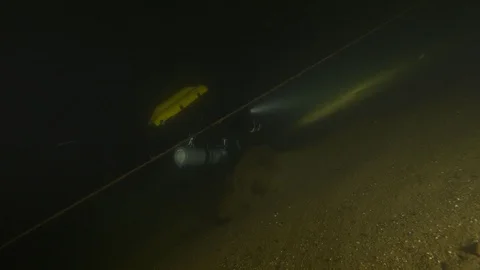 Diver following a guide line and arrives to box marks path, Albano lake, Italy Stock Footage 107364651