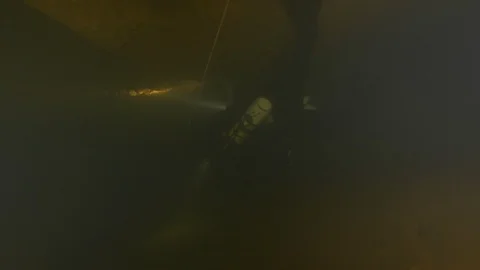 Diver follows guide line and enters the cave, Risorgenza Amaseno, Italy Stock Footage 109120573