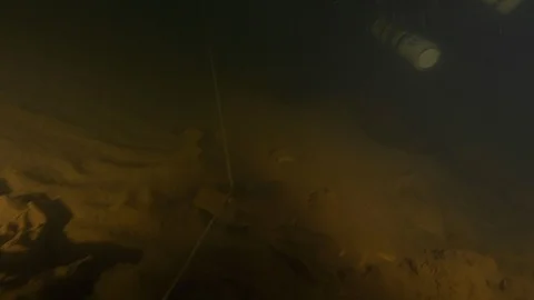 Diver follows guide line and enters the cave, Risorgenza Amaseno, Italy Stock Footage 109120601