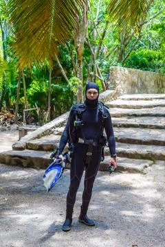 A diver in full gear ready to dive. Cave diving. Mexico Stock Photos