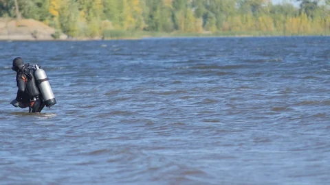 Diver Goes by the Water  Stock Footage 87600085