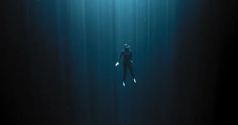 Diver going up with the sun rays Stock Footage 270111965