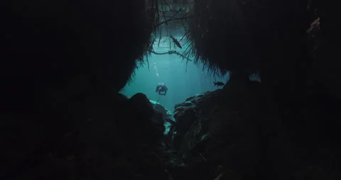 Diver going through a tight space in the cave Stock Footage 270105139