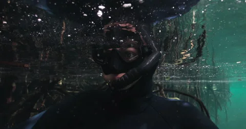 Diver just underneath the surface of water Stock Footage 270148035