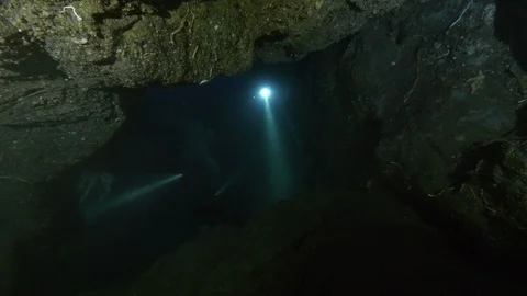 Diver light up underwater cave, Ustica, Mediterranean sea Stock Footage 126961947
