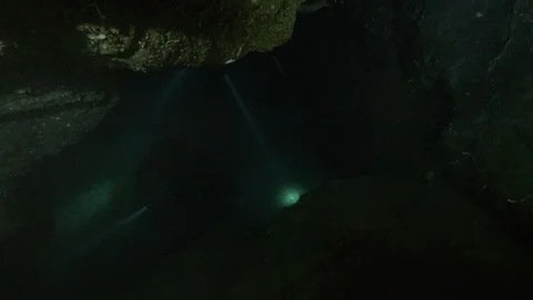 Diver light up underwater cave, Ustica, Mediterranean sea Stock Footage 126969104