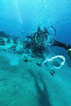 Diver man making bubbles underwater Egypt Stock Photos