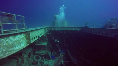 Diver photographing of shipwreck Stock Footage 63462690