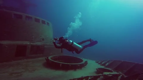 Diver photographing of shipwreck Stock Footage 63462762