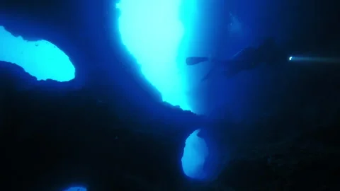 Diver plunges into ocean depths navigating breathtaking coral reef Stock Footage 305962321