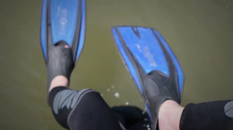 Diver putting his flippers on Stock Footage 48383325
