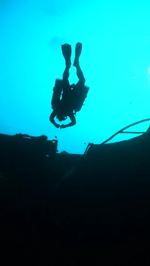 Diver shadow scuba diving Thailand technical side mount similans Stock Footage 246352950