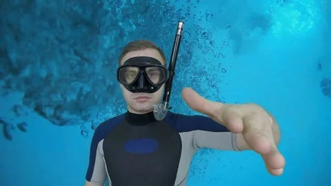 Diver shows signal – Something wrong Stock Footage 122963824